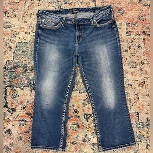 Mid Calf length cropped Silver jeans.